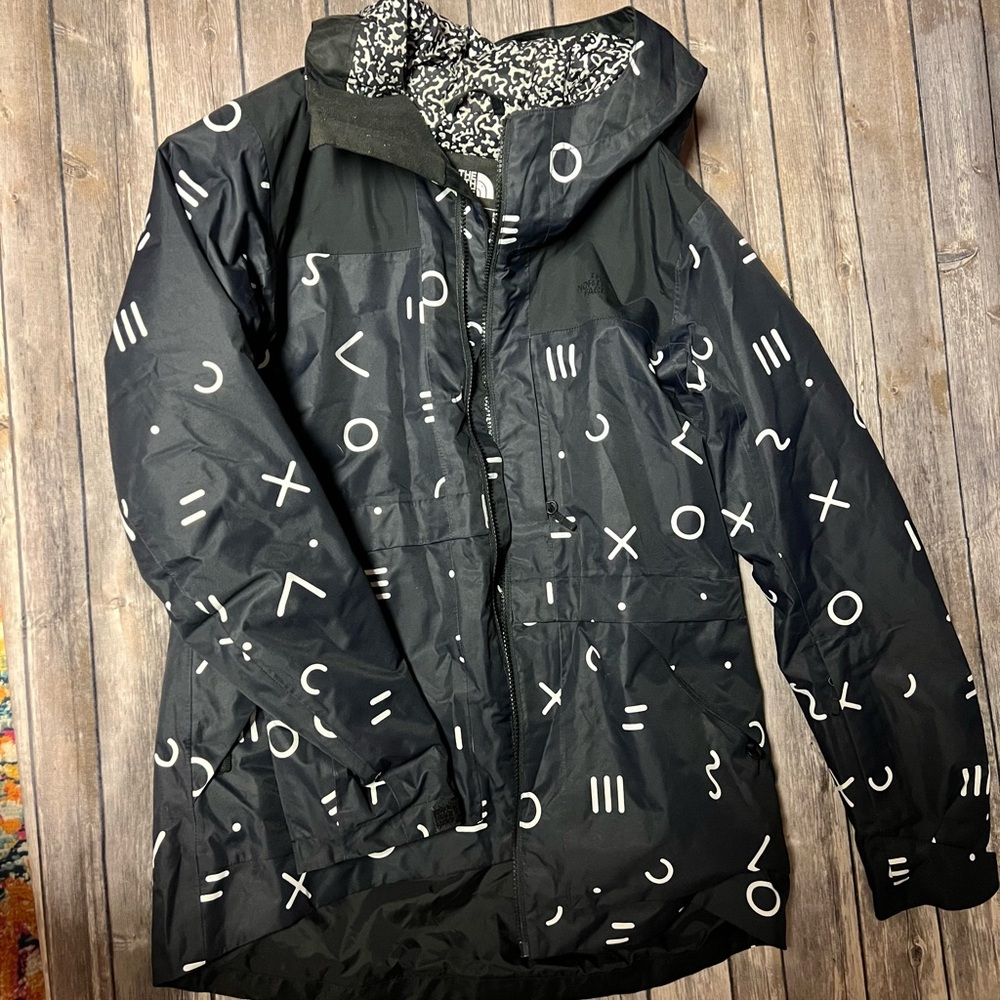 The North Face with Black and White symbols - Rain Jacket